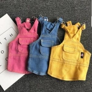 A group of three different colored overalls.