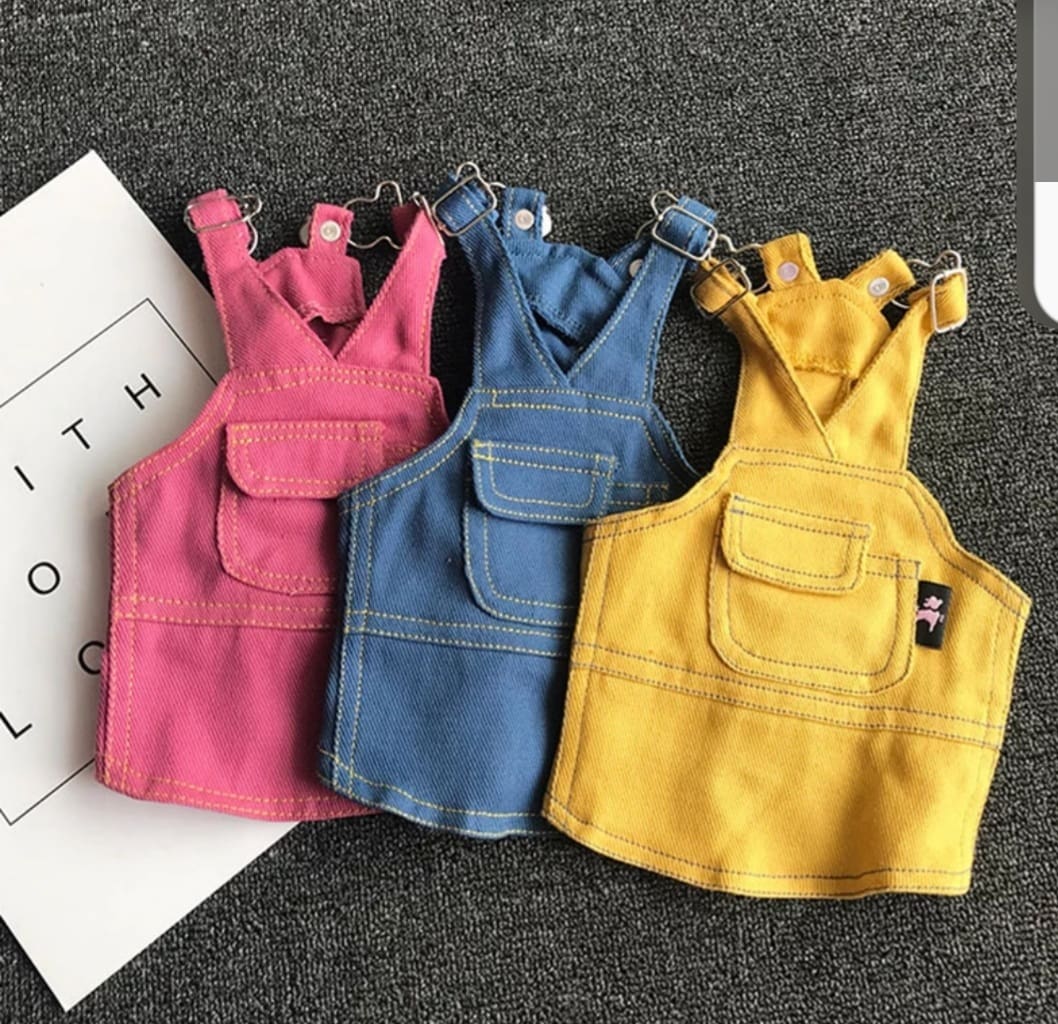 A group of three different colored overalls.