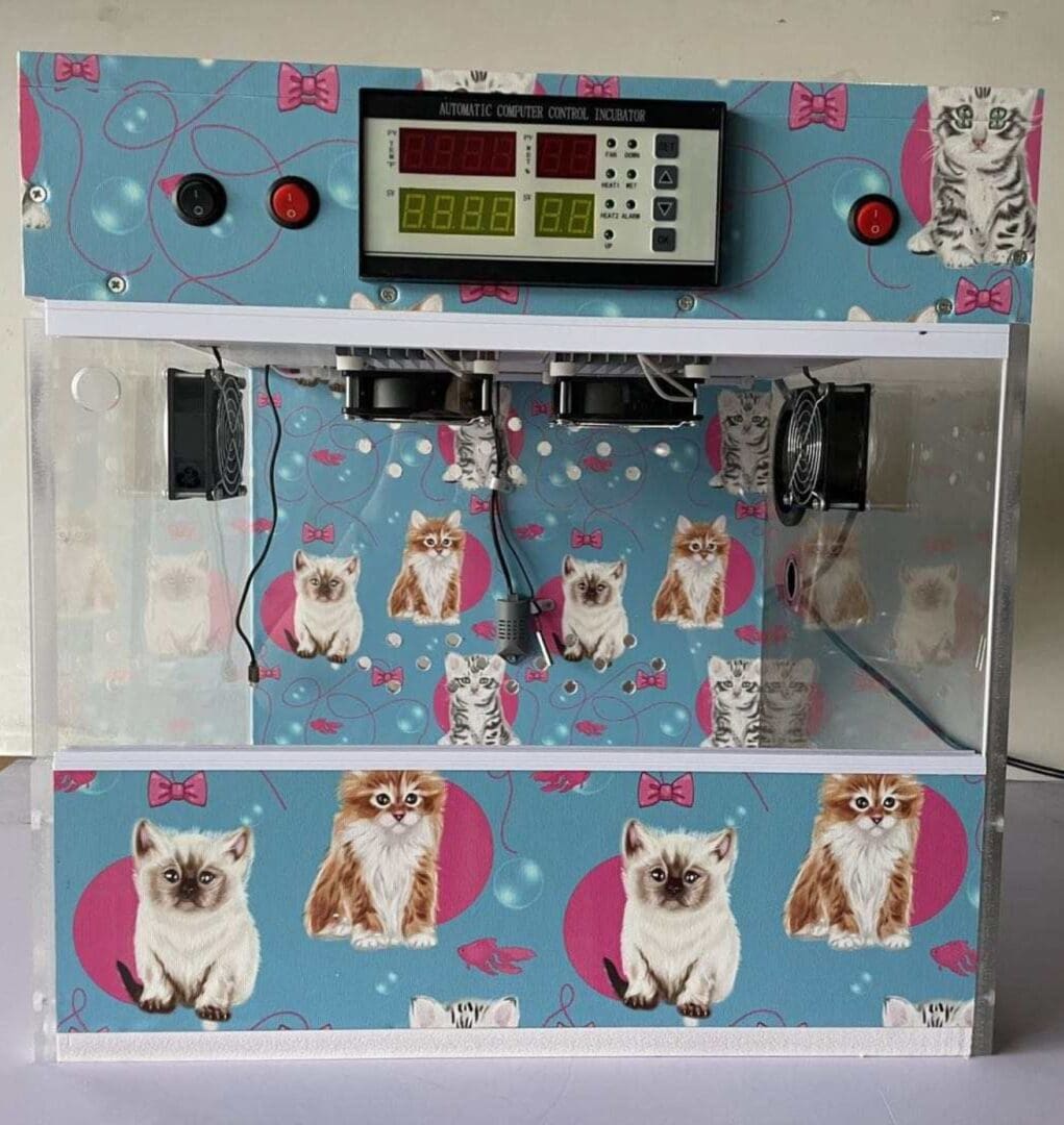 A small machine with cats on it