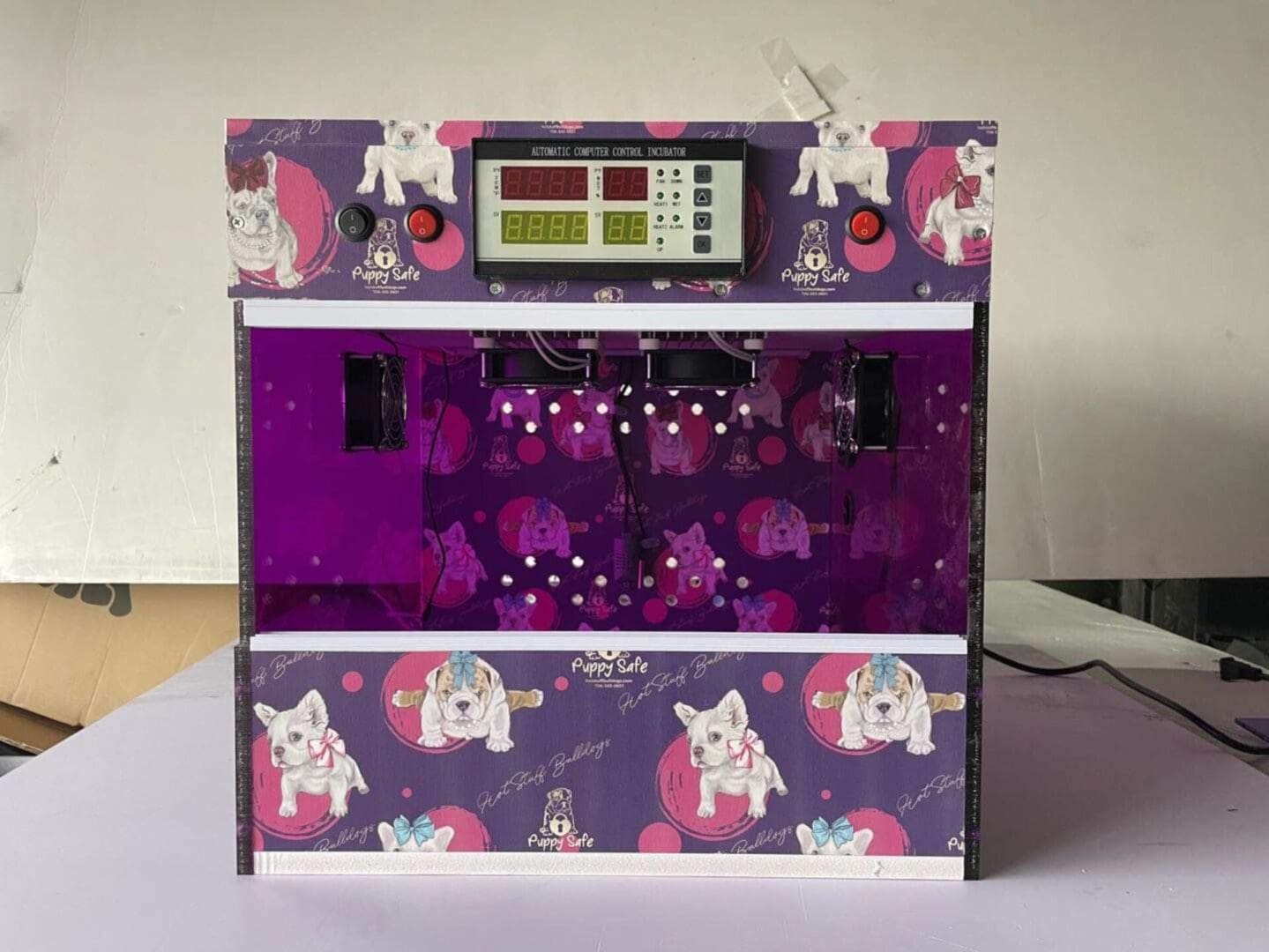 A purple machine with pink and white elephants on it.