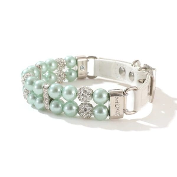 A bracelet with two rows of pearls and rhinestones.