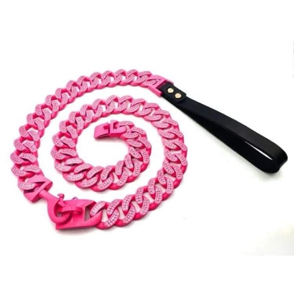 A pink chain with black handle on white background.